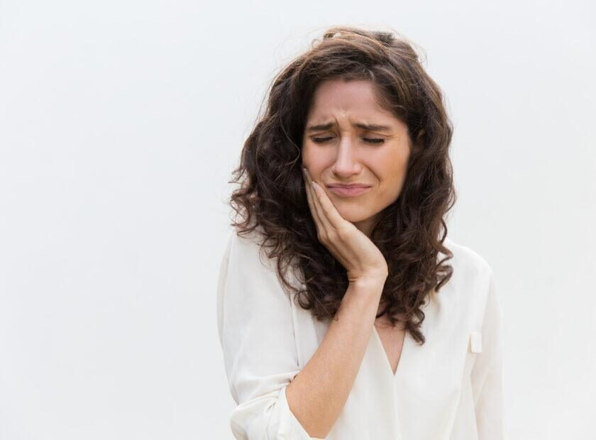 Frustrated unhappy woman suffering from toothache
