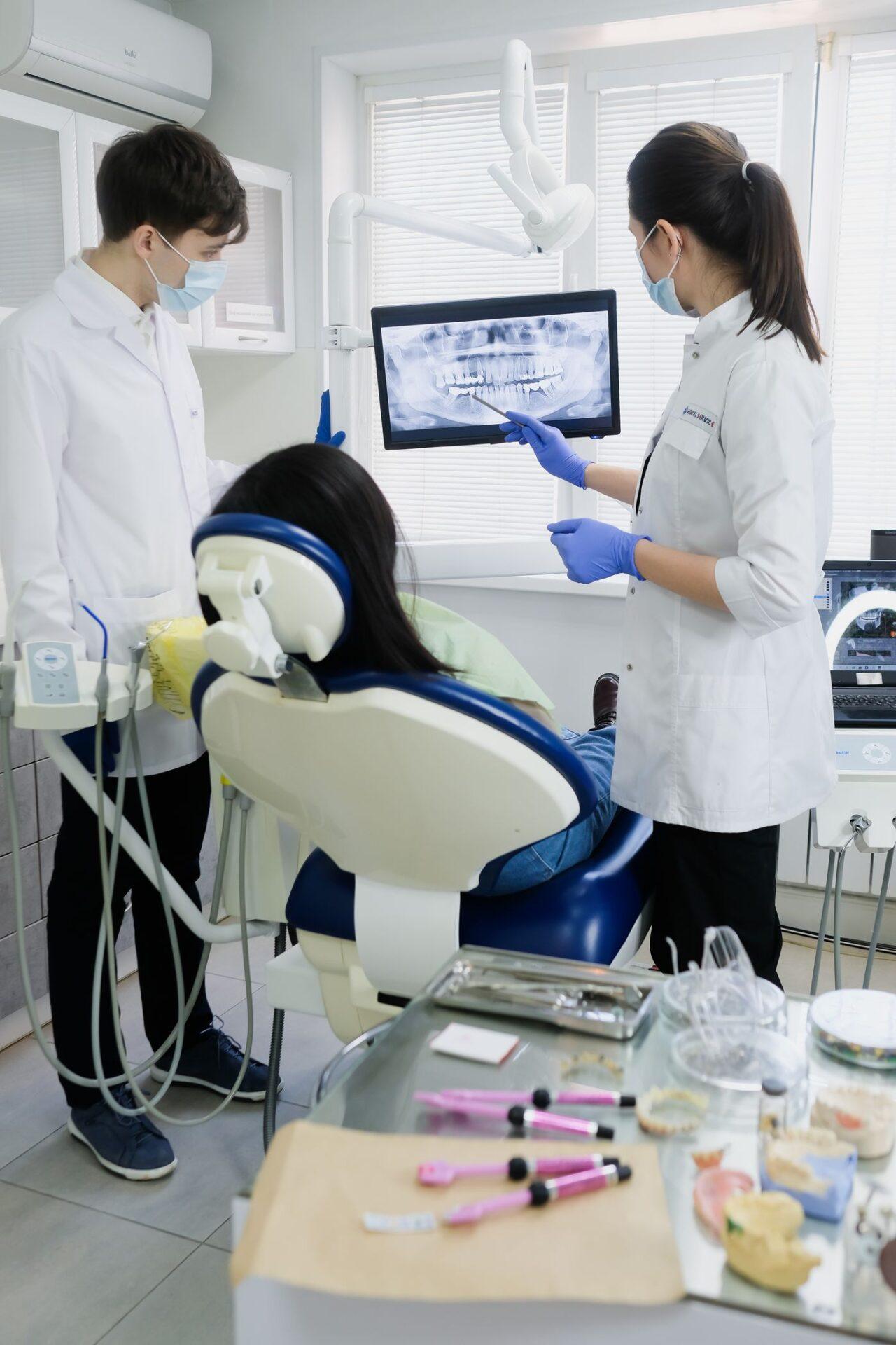 Dentists in Tillsonburg reviewing an X-ray to plan dental implants