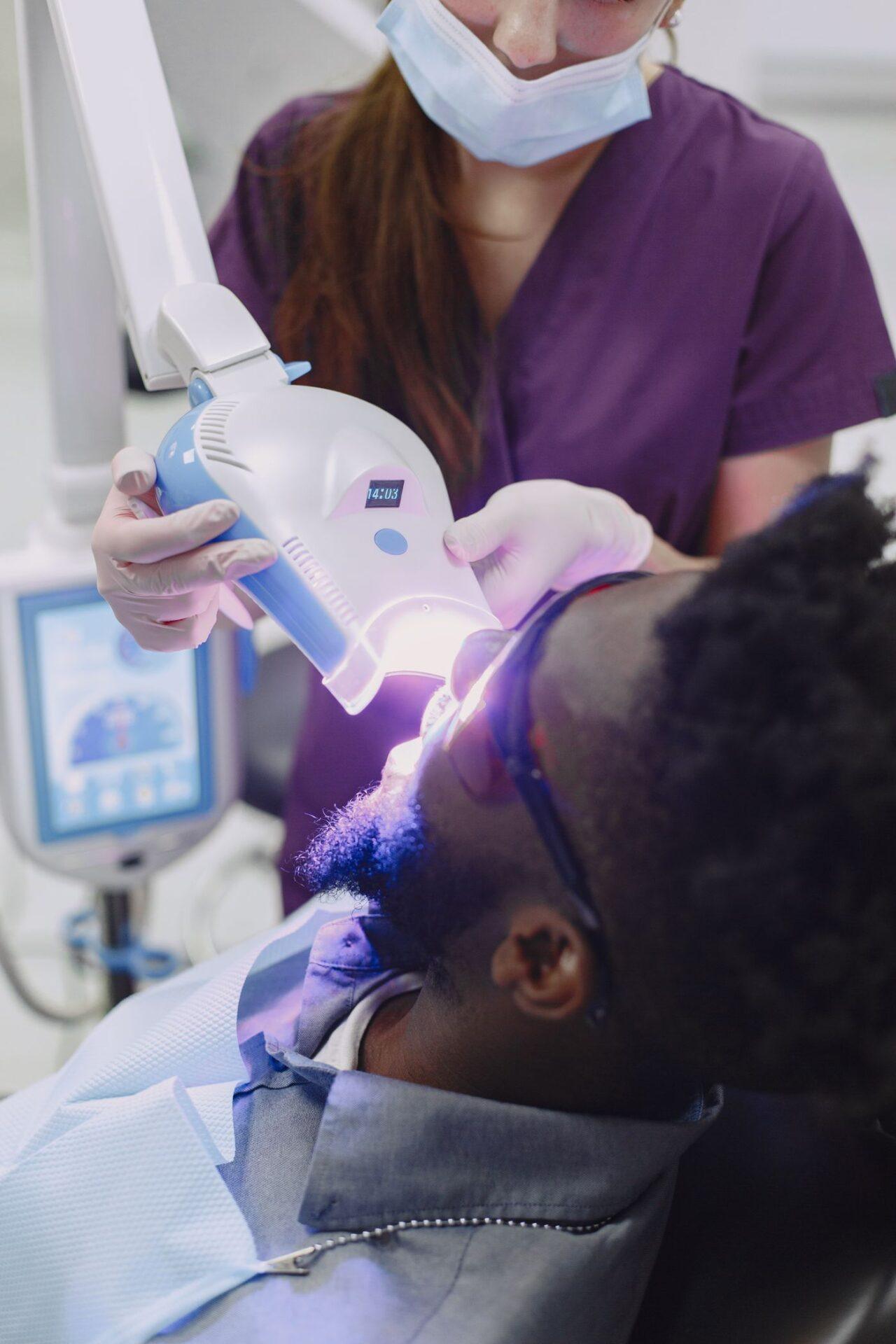 In-office teeth whitening treatment with a curing light in Tillsonburg